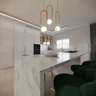 Beautiful white kitchen, with built-in refrigerators, Built-in oven and microwave and a large island with sitting space.