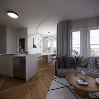 Modern open-concept interior with chevron wood floors, sleek kitchen, cozy gray sofa, and sheer curtains framing large windows.